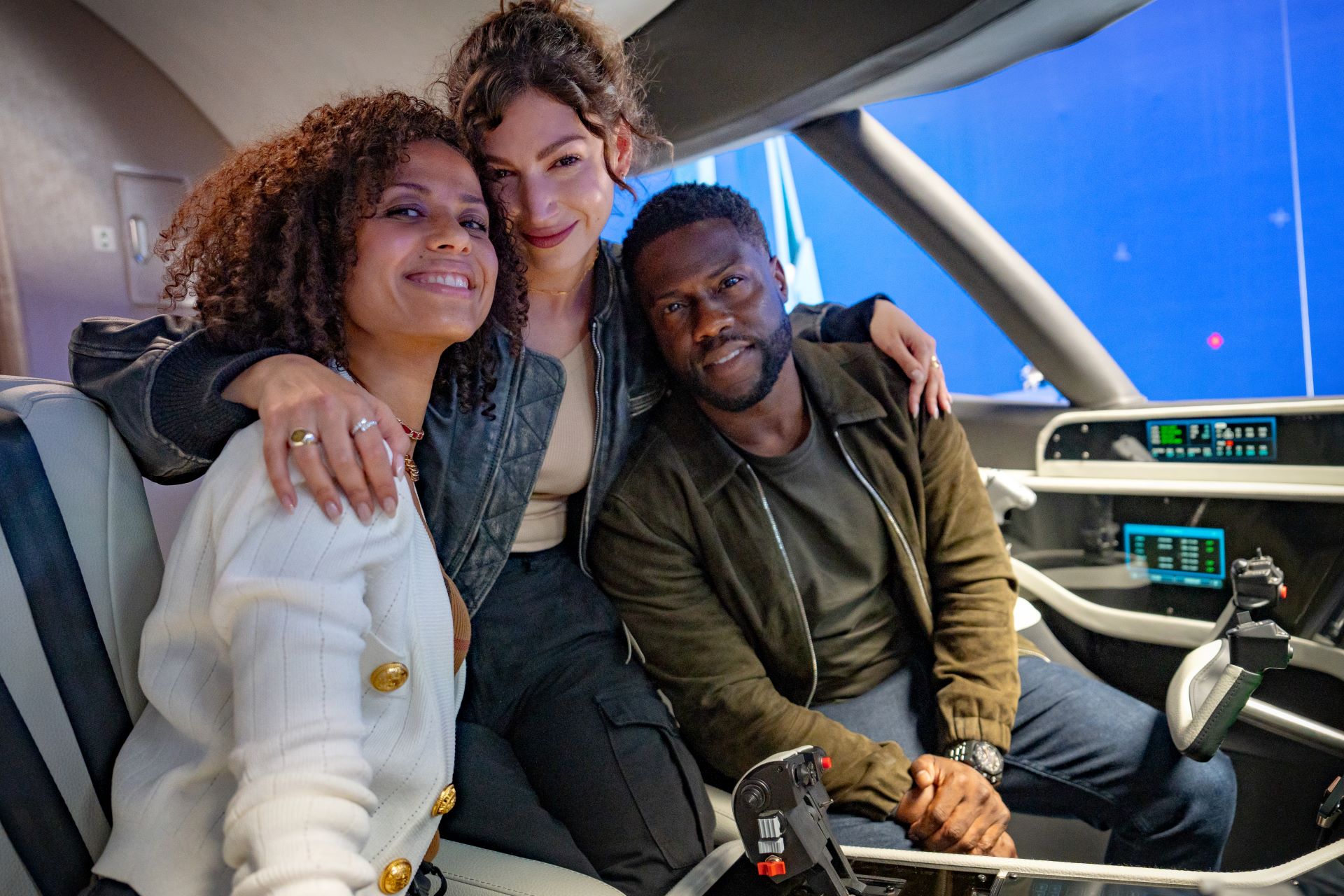 Gugu Mbatha Raw As Abby, Úrsula Corberó As Camila And Kevin Hart As Cyrus smiling for the camera on the set of lift