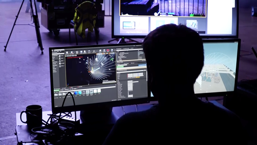 Professional working with a computer in a virtual production set