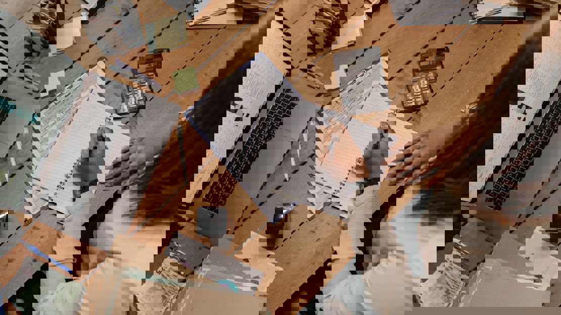 office worker writing on a notepad