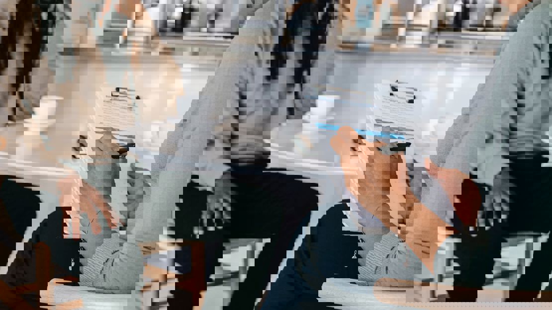 office worker taking notes during a meeting