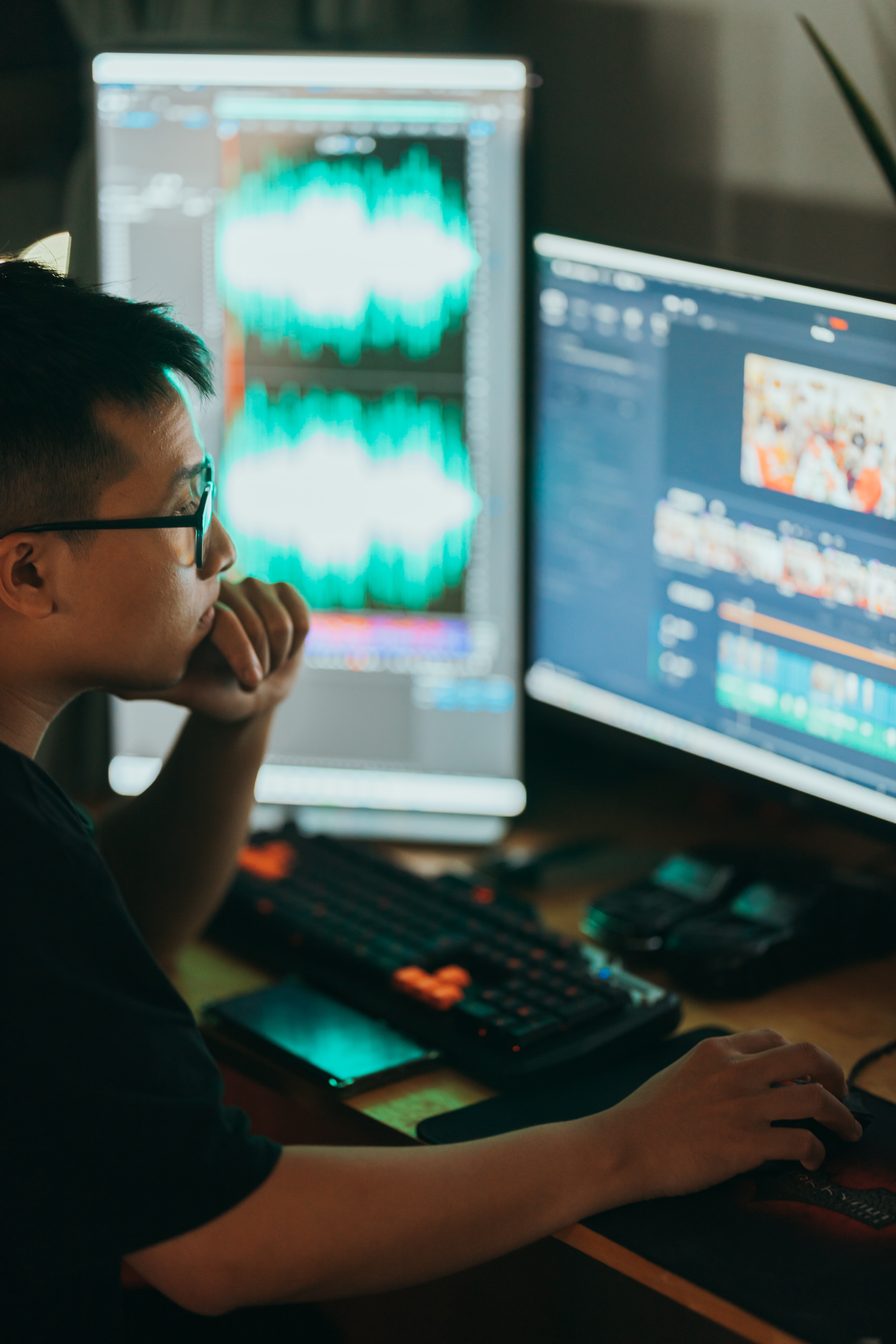 Post-production assistant working on a computer