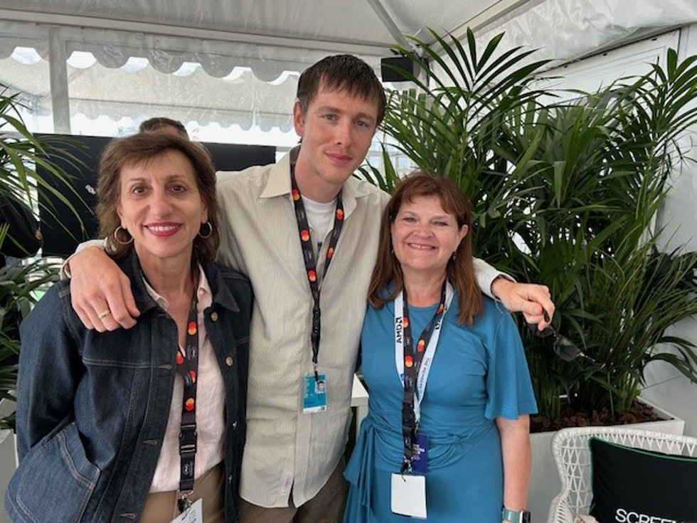 ScreenSkills' Naomi Joseph and Emma Turner with Harris Dickinson in a tent at the Cannes Film Festival 2025