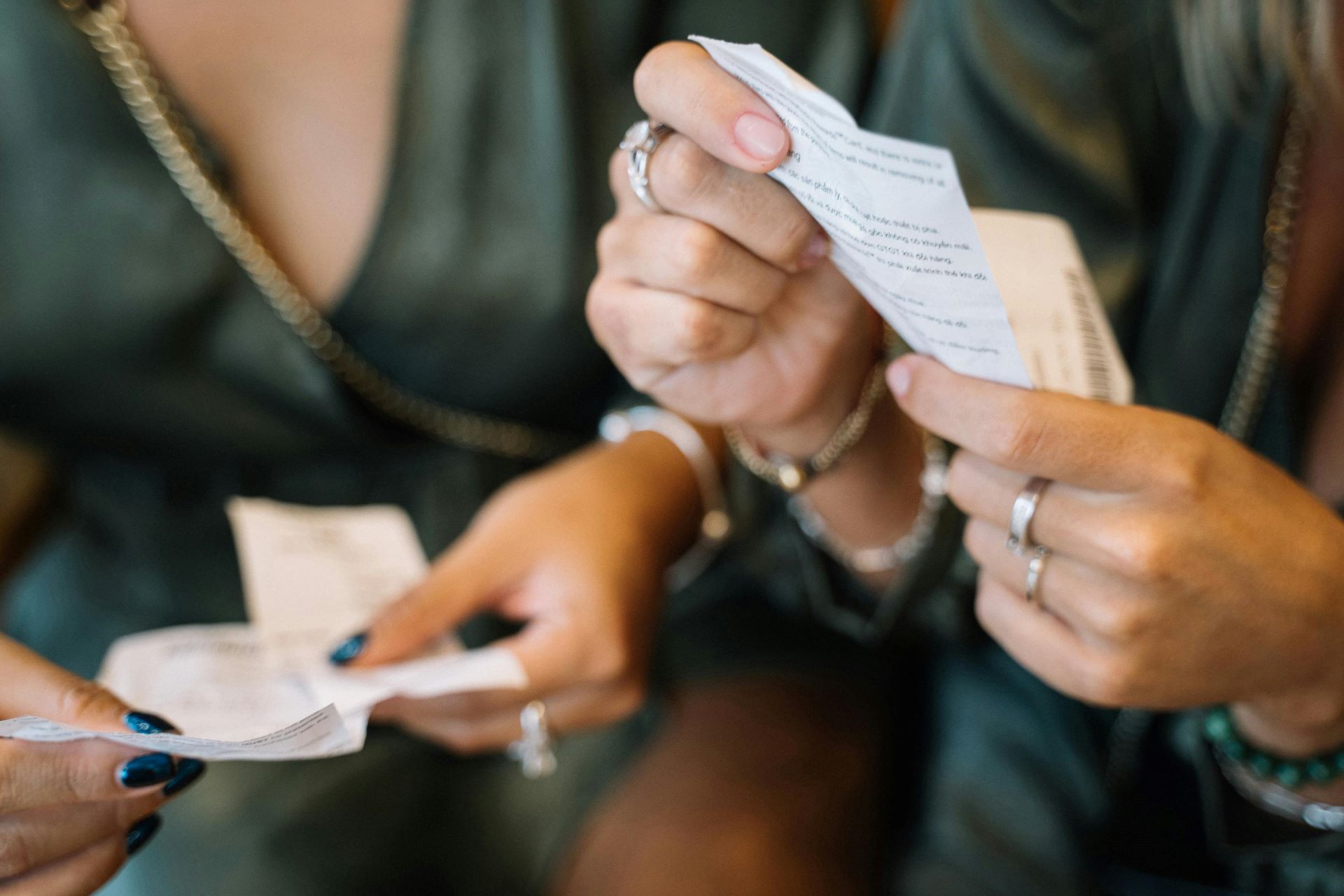 Close up of hands holding receipts