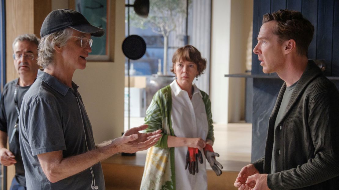 Director, Jay Roach, speaking to Benedict Cumberbatch and Olivia Coleman on the set of The Roses