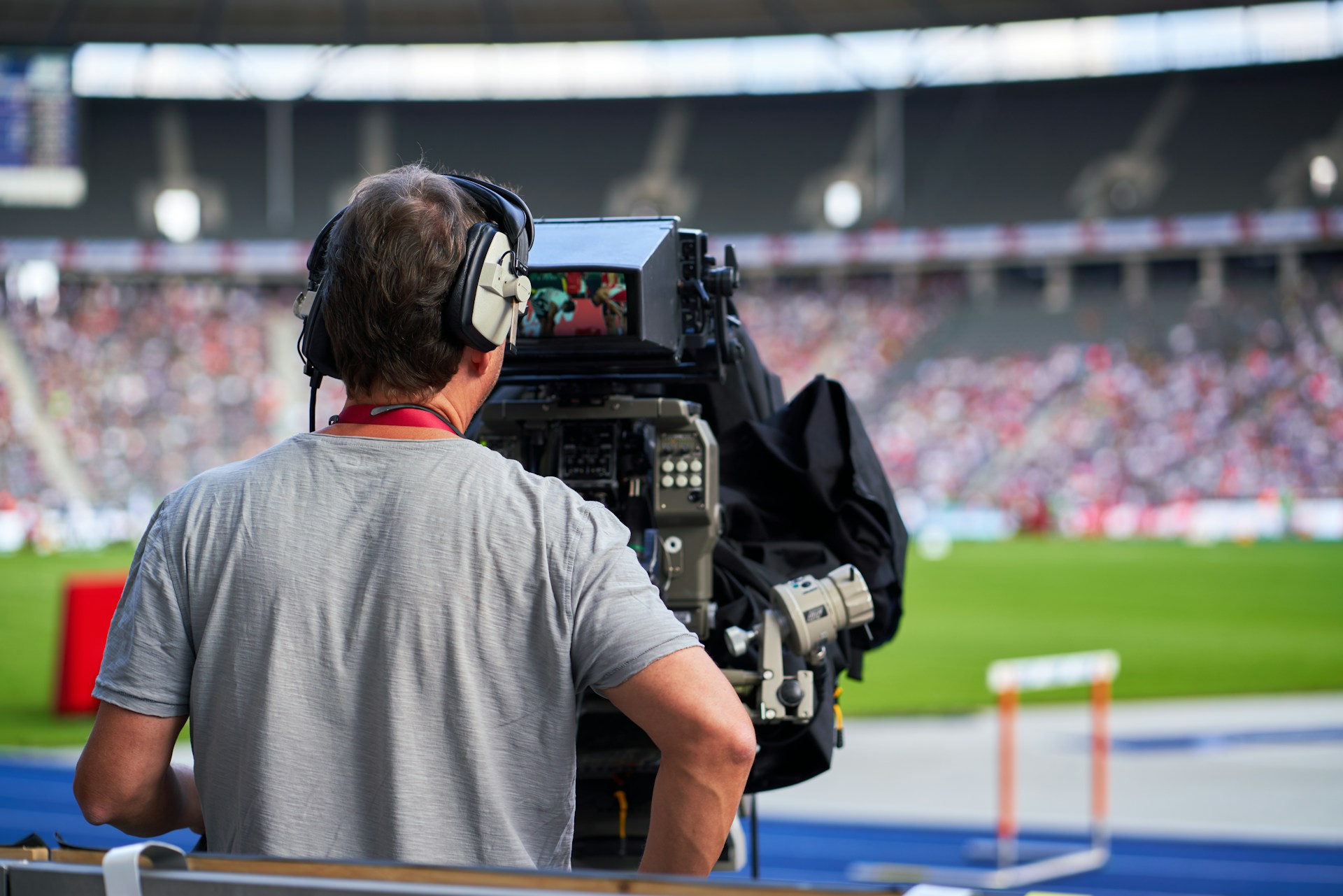 A picture of a camera operator at a sports match