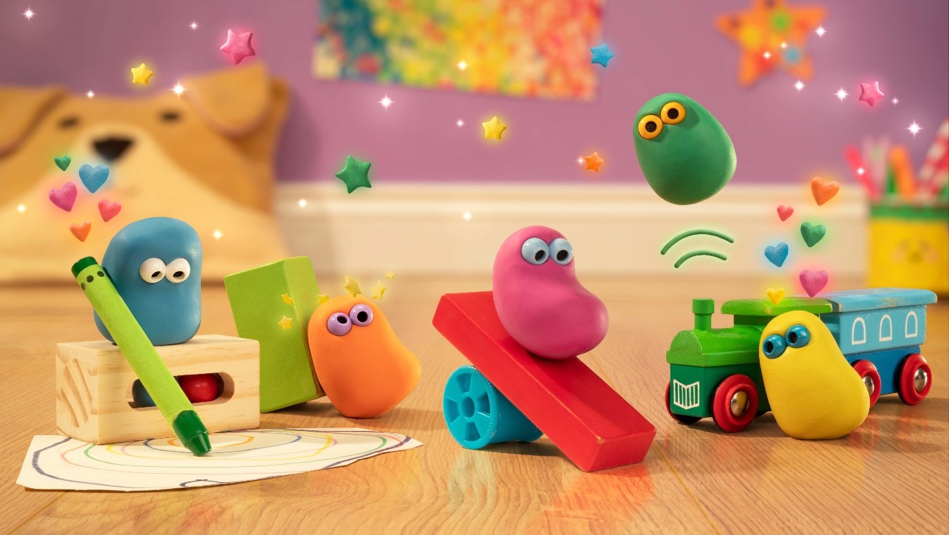 Five colourful animated clay creatures play with toys in a children's nursery
